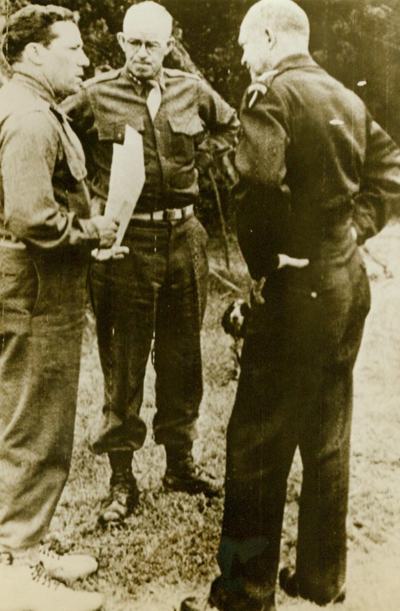 Planning Normandy Break-Through, 7/27/1944. Talking over plans for the record-breaking mission by 1800 heavy bombers which paved the way for the shattering of German lines beyond St. Lo, are, (Left to Right): Maj. Gen. Edwin L. Quesada, of Washington, D.C., Commanding General, 9th fighter command; Lt. Gen. Omar N. Bradley, commanding General, U.S. Ground forces in France; And Gen. Dwight D. Eisenhower. This was Eisenhower’s sixth visit to the Normandy front since the invasion 7/27/44 (ACME RadioTelephoto); And Gen. Dwight D. Eisenhower. This was Eisenhower’s sixth visit to the Normandy front since the invasion 7/27/44 (ACME RadioTelephoto);