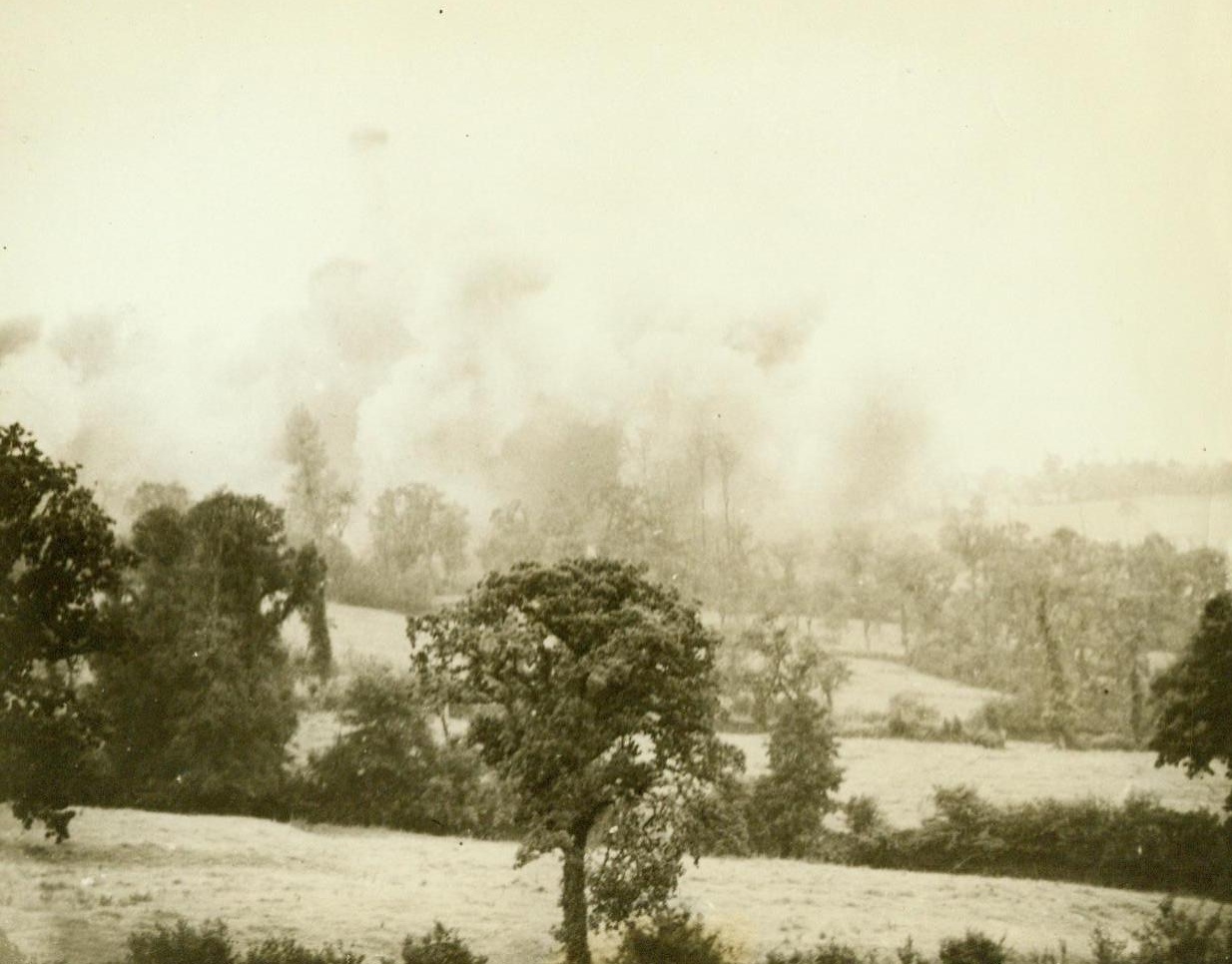 Photographer's Last Picture, 7/27/1944. This photo, taken by Bede Irvin, Associated Press War Pool photographer, just before he was killed by a bomb fragment near St. Lo, France, shows thousand-pound bombs busting on German lines just before the American breakthrough. The film pack containing this graphic equipment left intact by the bomb that killed him. Sent from the front by a fellow cameraman. 7/27/44 (ACME);