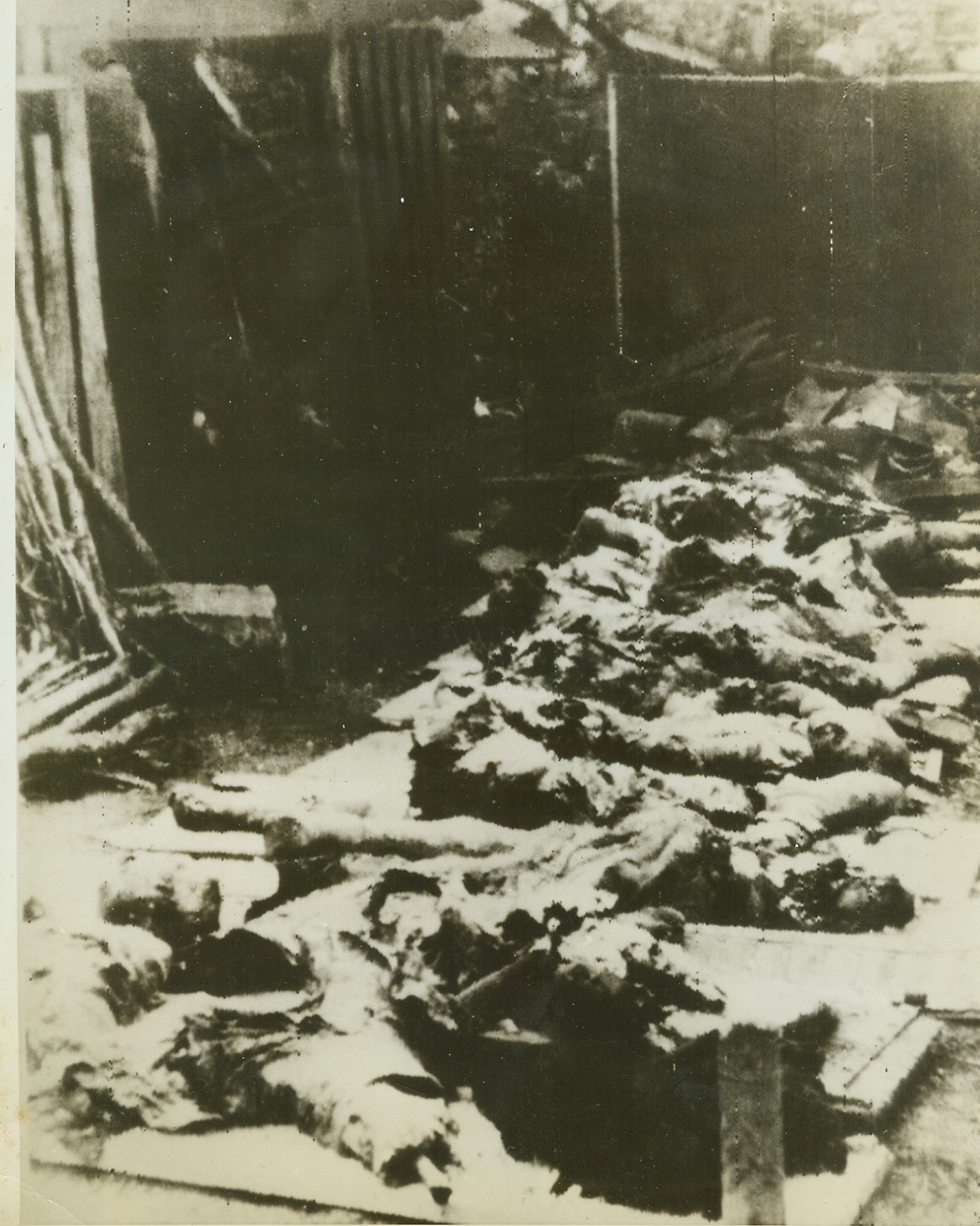 Nazis Make French Town Another Lidice, 7/22/1944. France—In this radiophoto smuggled out of occupied France and received in New York from London tonight, badly mutilated bodies of civilians of Oradour, France, give evidence of the Nazi terrorism which turned the town into another lidice. As Allied liberators advance relentlessly inland, Nazis resort more and more in desperation to ruthless destruction of land, property, and human lives.  Credit: ACME radiophoto;