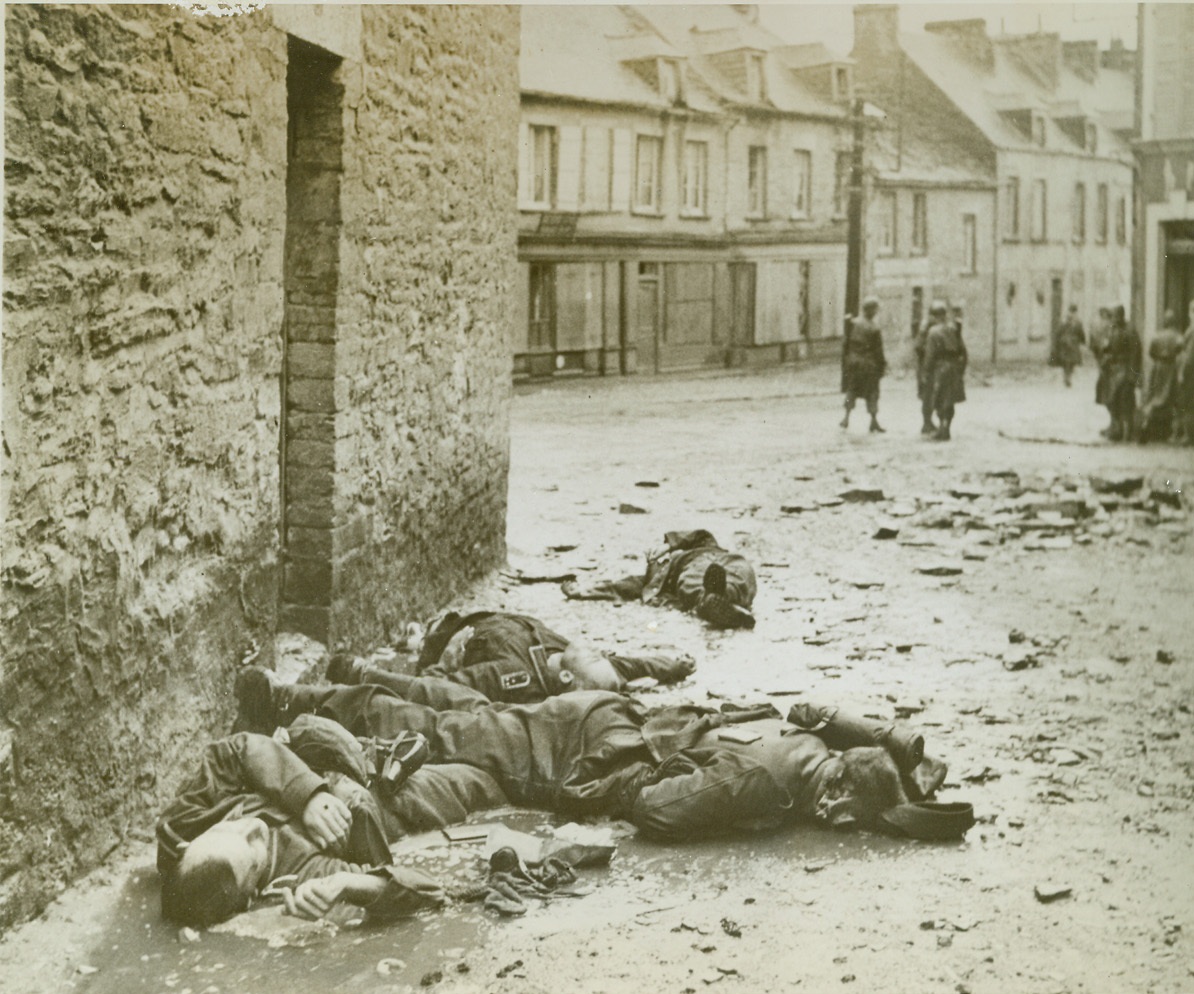 Cherbourg Defense Ends in Death, 7/1/1944. Cherbourg, France—Lying in a pool of muddy water, these Germans died as they tried to defend Cherbourg against the terrific onslaught of American forces. Their death was to no avail, for Cherbourg fell in inglorious surrender.  Credit: ACME photo by Bert Brandt, war pool correspondent;