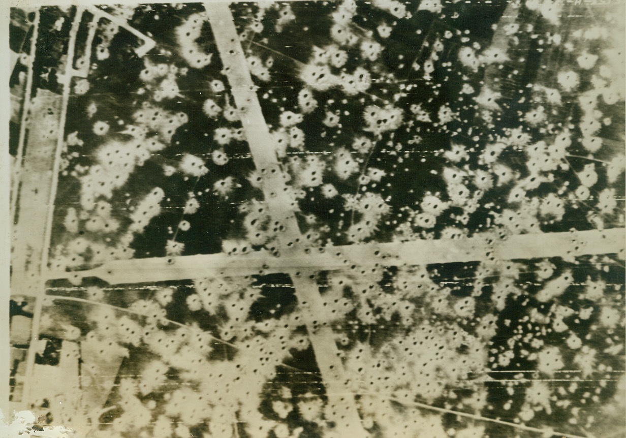 AIR HOLES IN AIRFIELD, 8/20/1944. BELGIUM – Bomb craters slash across the runways and the surrounding parking areas are splattered with the pits after an attack on Le Culot Airfield by RAF bombers on August 15. Renewed Allied air offensive is greatly responsible for keeping the Luftwaffe almost grounded. This is a British official Air Ministry photo. Credit: U.S. Army Radiotelephoto from ACME;