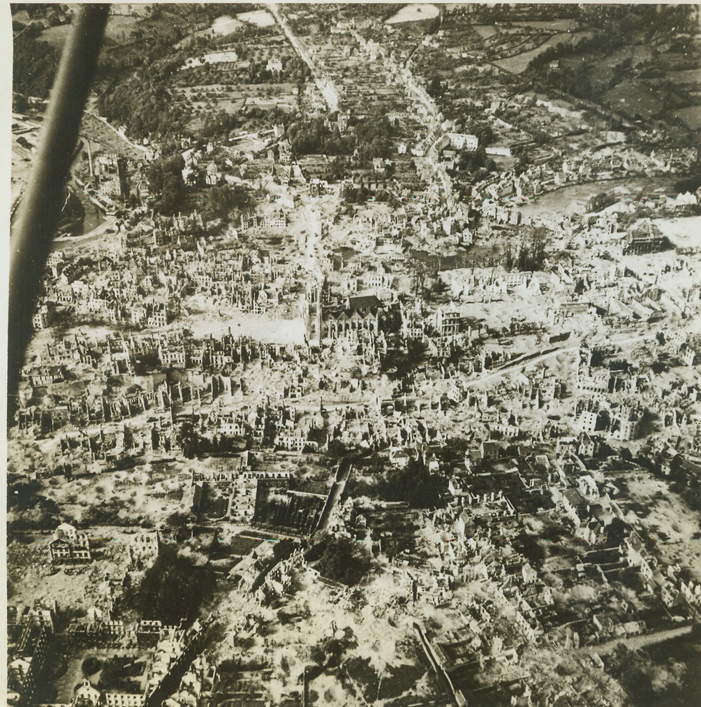 Battle-Ravaged St. Lo, 8/8/1944. This airview from an Allied plane shows the terrible extent of damage suffered by St. Lo in the flaming battle for the possession of the Cherbourg peninsula, in France. Credit: (ACME) (WP);