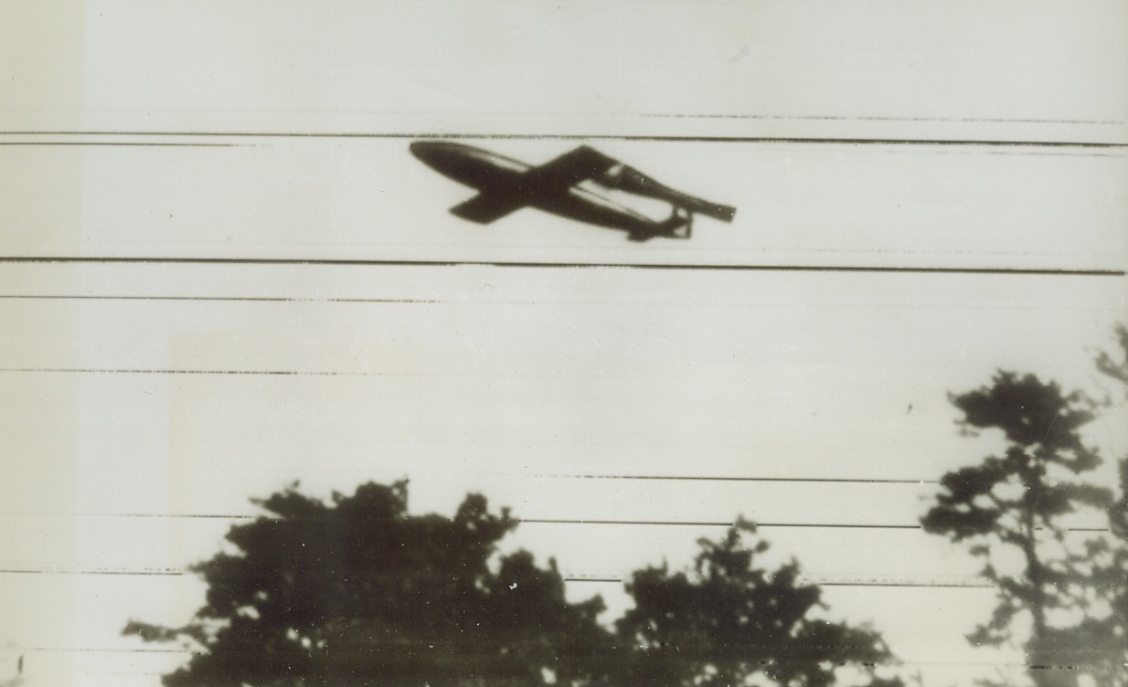 HEADING FOR TROUBLE, 8/9/1944. BERLIN—Out for no good, this Nazi V-1 flying bomb is heading into trouble of its own making as it rattles toward England. Photo radioed to New York from Stockholm today (August 9th). Credit: Acme radiophoto;