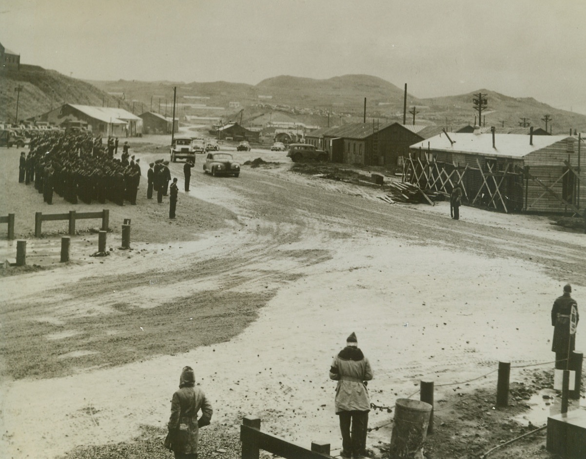 Roosevelt Sees Aleutian Bases, 8/11/1944. A guard of honor salutes the presidential car as it rolls through the mist and rain on an inspection tour of bases in the Aleutian islands.  The president visited this Northern outpost after meeting with military and naval leaders at Pearl Harbor during his tour of Pacific bases. Credit (U.S. Army photo from ACME);