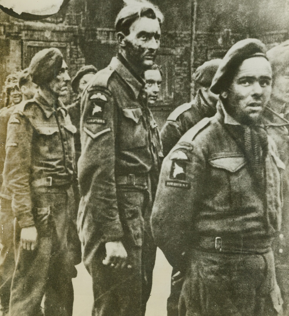 British Soldiers Captured in Normandy, 8/1/1944. Normandy, France – According to the German caption accompanying this photo received in London from a neutral source, these men are British soldiers who have been captured by the Germans in Normandy. Credit: ACME;