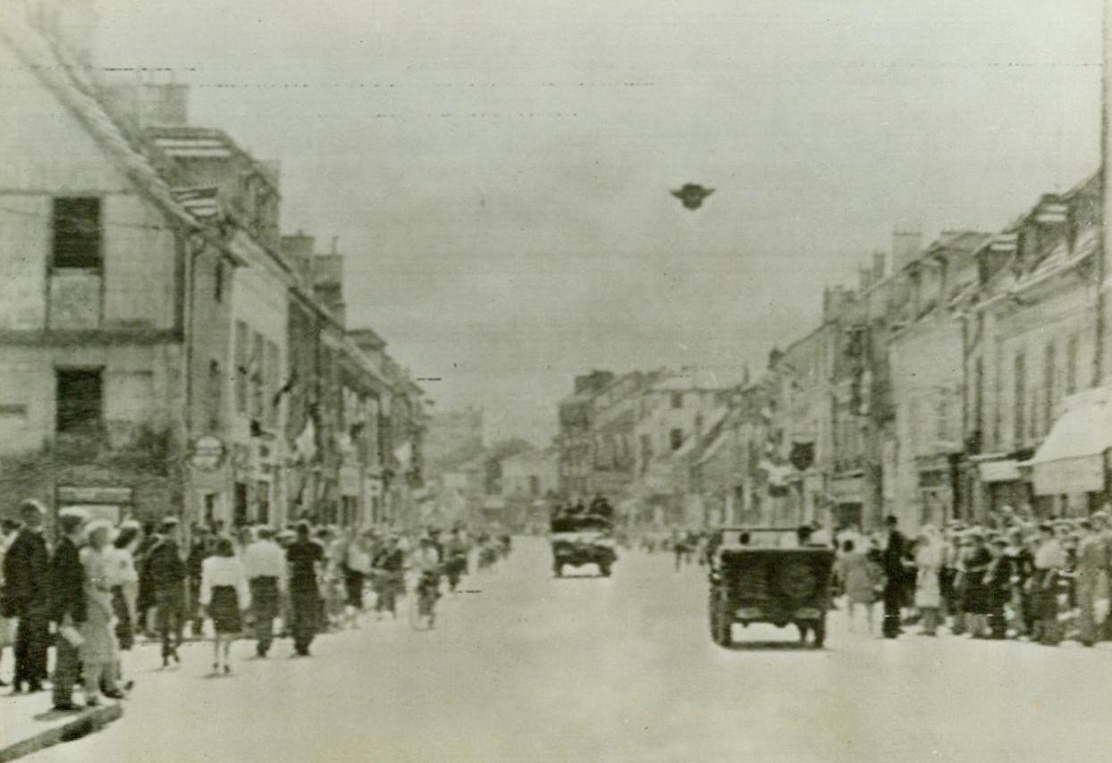 American Vehicles Enter Paris, 8/25/1944. American vehicles trickle through Nazi defenses surrounding Paris as the battle rages on in other sections of the city. 8/25/44 (ACME);