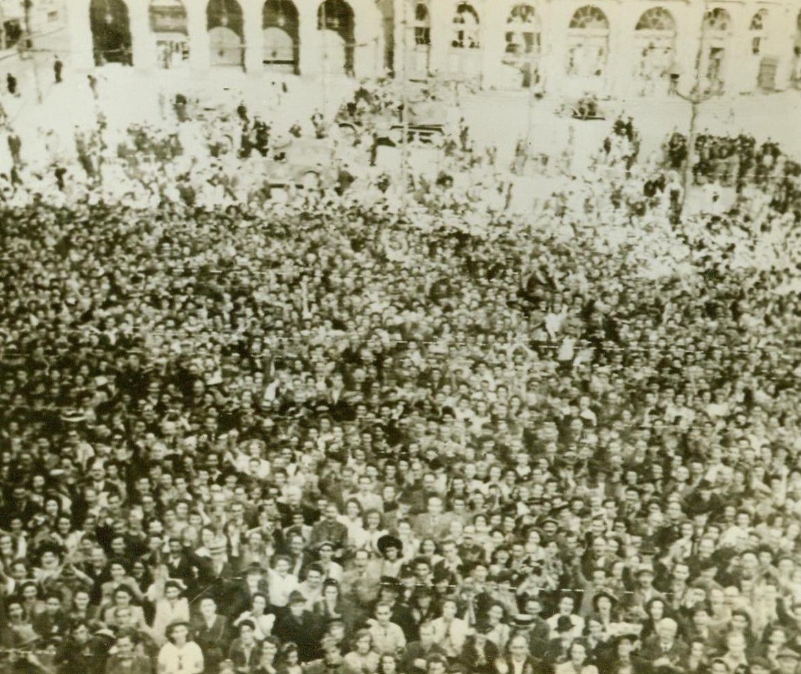 Rennes Greets Her Liberators, 8/6/1944. The population of Rennes, largest French city to fall to Allied troops to date, turns out en masse to greet the Army of Liberation. Our warriors received a tremendous ovation from the crowds as they rolled through the newly-captured city.;