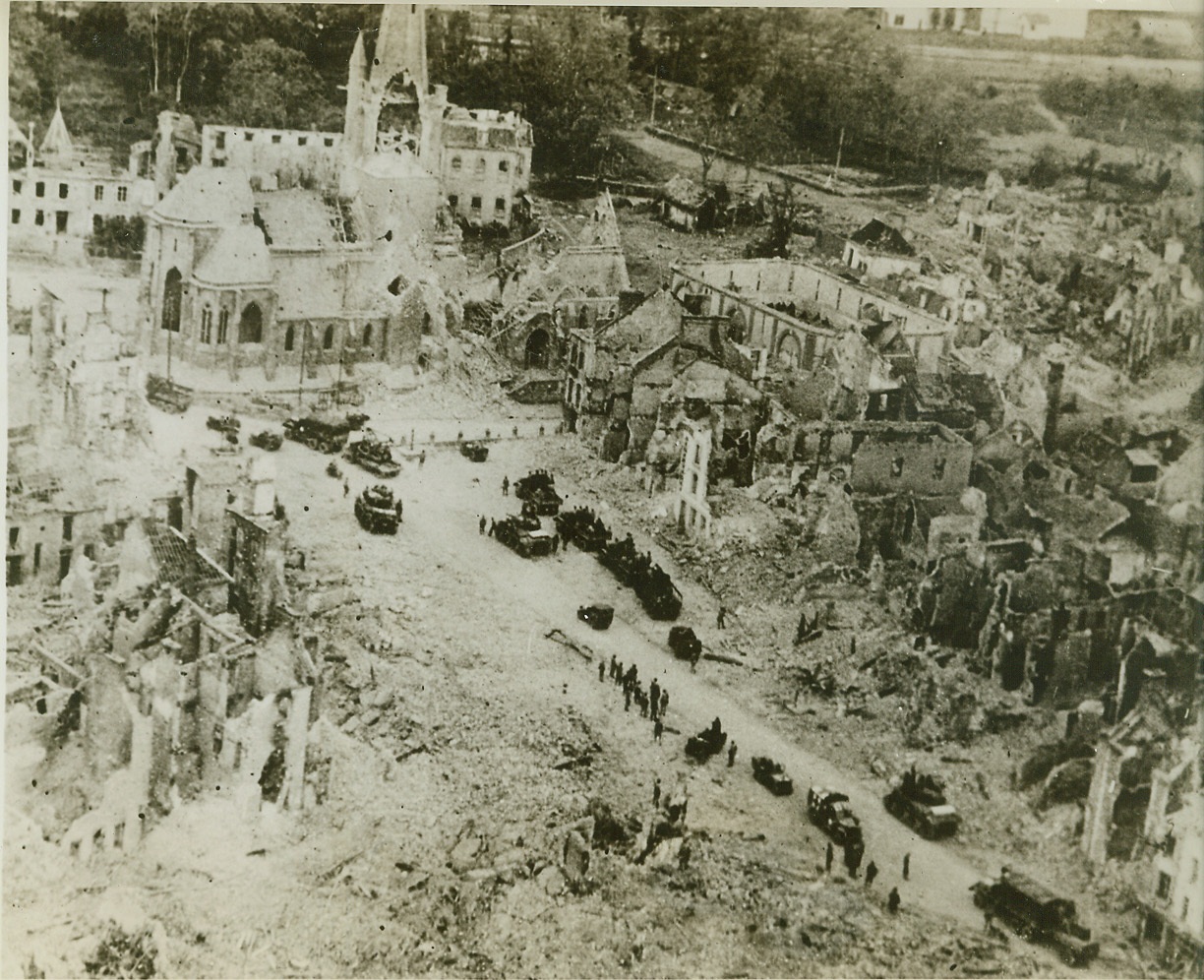 The Aftermath of Battle, 8/6/1944. PERIERS, FRANCE -- American tanks and trucks wend their way into Periers, a mass of destruction from the fierce battle that preceded its capture. American forces have stormed into Brest, France's 2nd port, completing the isolation of the Brittany Peninsula from German forces in the remainder of France. Credit (ACME) (WP);