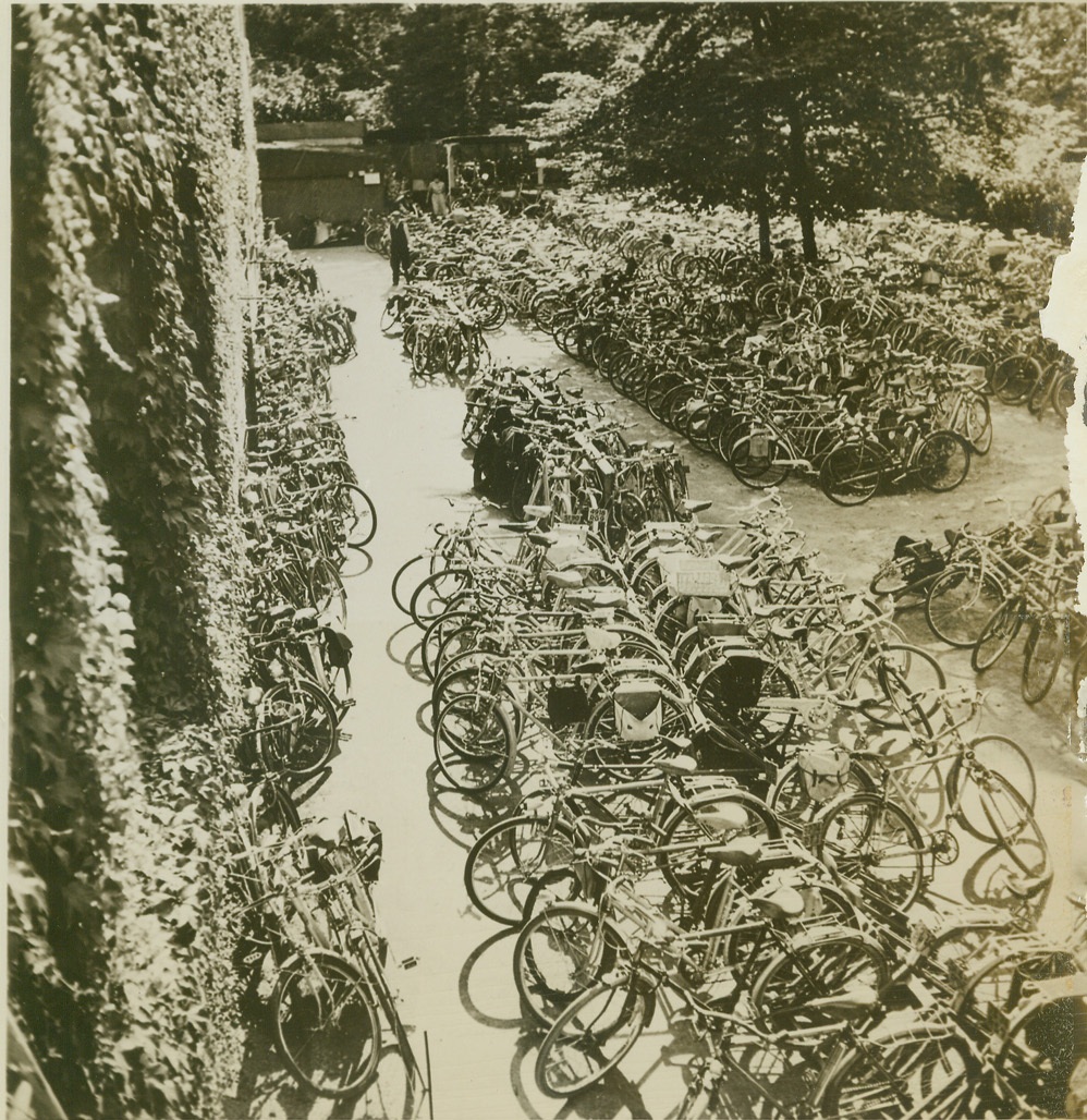 OFF TO THE RACES, 9/23/1944. PARIS – As Paris again takes up the threads of a normal life, the only difference at the Racing Club in the Bois du Boulogne is the parking lot. Once jammed with swank cars, the area is filled to capacity once more, but with bicycles. Paris is still gas-less and car-less, so the sole means of transportation is bicycles, and practically ever Parisian owns one. Credit: ACME;