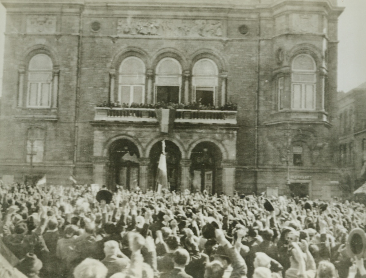 CHEER LIBERATION OF LUXEMBOURG, 9/13/1944. Wildly cheering citizens crowd before the City Hall as Prince Felix of the Duchy of Luxembourg stands on the balcony to greet them after liberation by the Allies. Credit: Army radiotelephoto from Acme;