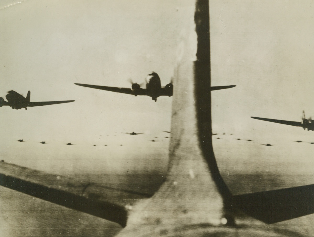 They’re on Their Way!, 9/18/1944. EN ROUTE TO HOLLAND – Roaring toward Holland for the surprise airborne invasion that made supermen quake, troop-carrying planes stretch across the European sky, as far as the eye can see. This was just part of the giant sky train that brought thousands of liberators to Dutch soil.Credit (Army Radiotelephoto from ACME;