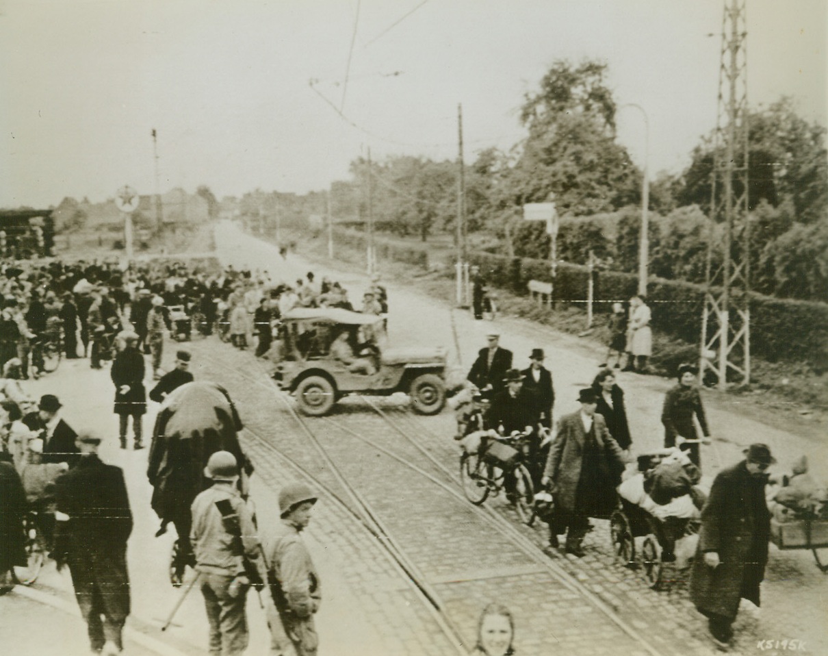 Hollanders Flee Homes, 9/7/1944. Carrying all of the belongings possible, civilians flee the town of Kerkrade, Holland, to escape the flame of battle.Credit Line (Army Radiotelephoto from Acme);