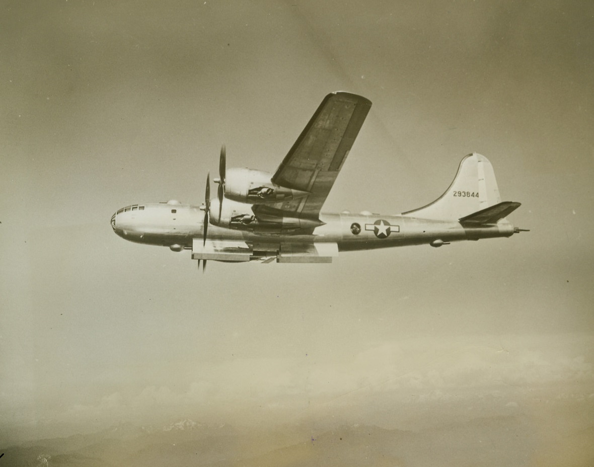 Superfortress Carries Five Gun Turrets, 9/8/1944. For the first time the gun positions on the Boeing Superfortress are shown. Five turrets, each with two .50 caliber guns, are placed at strategic positions on the bomber: upper-forward turret, lower-forward turret, upper-rear turret, lower-rear turret, and the tail-mount, which is also armed with a 20-mm. cannon. The fire-control system makes possible the operation of all guns by gunners in different parts of the bomber, with an electrical control that makes for instantaneous and heavy concentration of fire on any target. Credit: ACME;