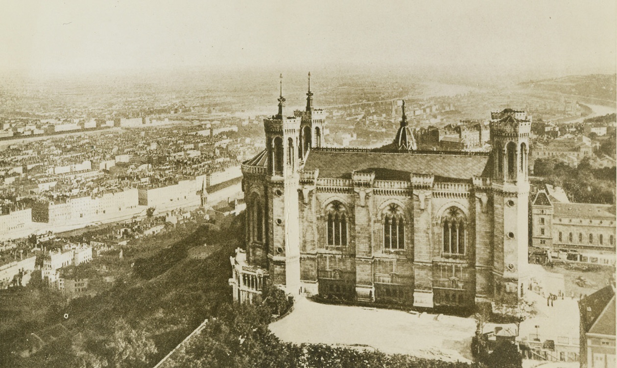 YANK AND FRENCH FORCES CAPTURE LYON, 9/3/1944. This is a general view of Lyon, the third city of France, which was reported captured by American and French forces yesterday (Sept. 2).  Street fighting is still reported in progress in the city which the Germans, by blowing up nine of the ten bridges across the Rhone and Saone rivers, had divided into three sections.  The virtual capture of Lyon meant that in the past 12 days the Allied armies and the Maquis had liberated the first five cities of France – Paris, Marseille, Lyon, Bordeaux, and Nice.Credit: Acme;