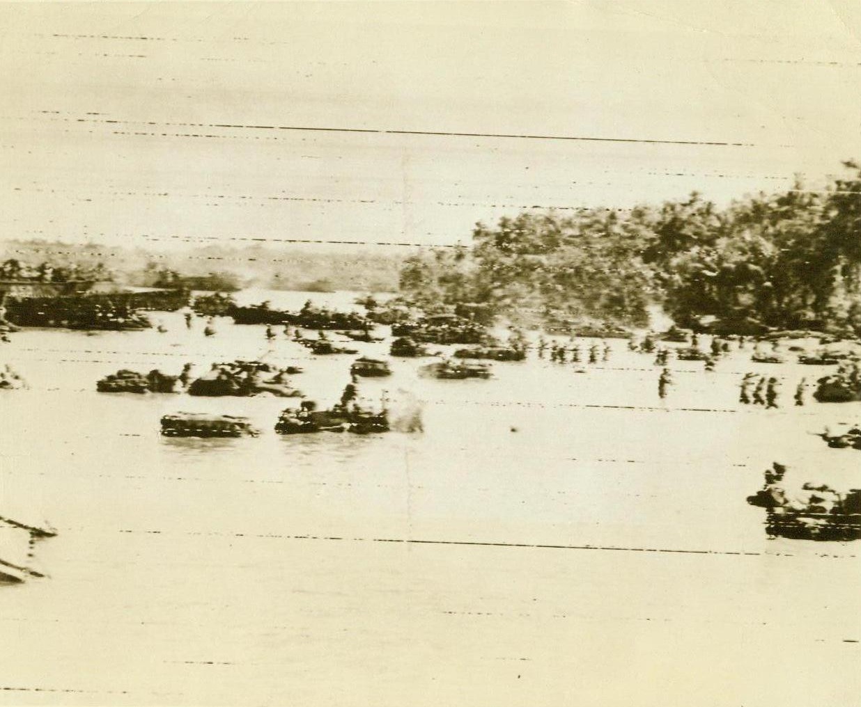 Allies land on Morotai, 9/17/1944. Morotai Island- Wading, chin-deep, in the waters off the shore of Morotai Island, in the Halmahera group, allied infantrymen splash toward the well-pounded beach. Although the island is only 250 miles south of the Philippines, the invaders ran into no organized Jap resistance. Engineers began construction work at Pitu airfield almost immediately.;