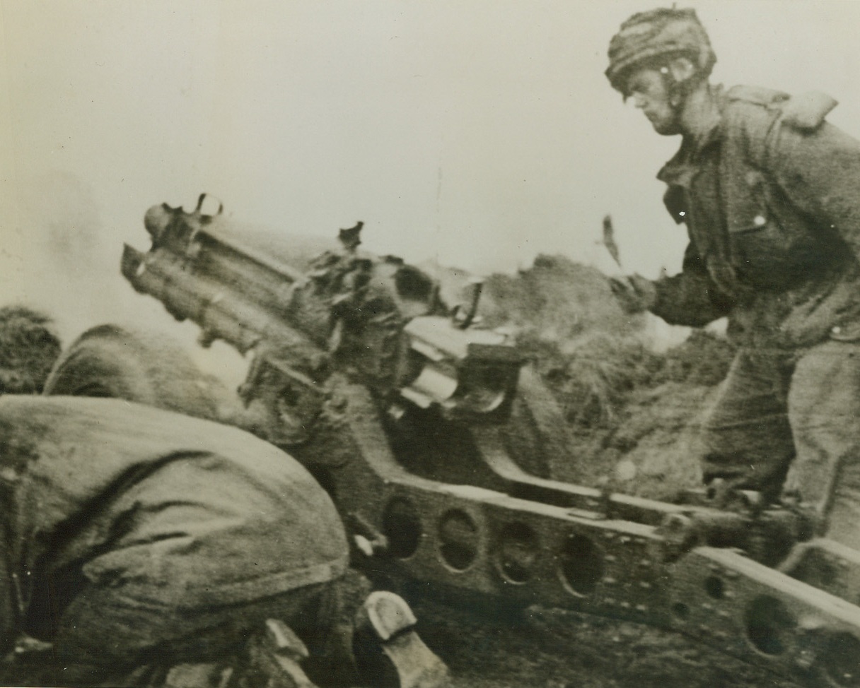 While They Fought the Gallant Fight, 9/28/1944. While the deathless heroes of Arnhem—that group of British paratroopers of the First Allied Airborne Army which resisted “like lions” in the face of overwhelming German pressure for nine days—were still holding their “little corner of hell,” this photo of several of the group firing a 75mm. howitzer, was taken. It reached the U.S. by Radiotelephoto, today. Credit: British War Office photo via U.S. by Radiotelephoto from ACME;