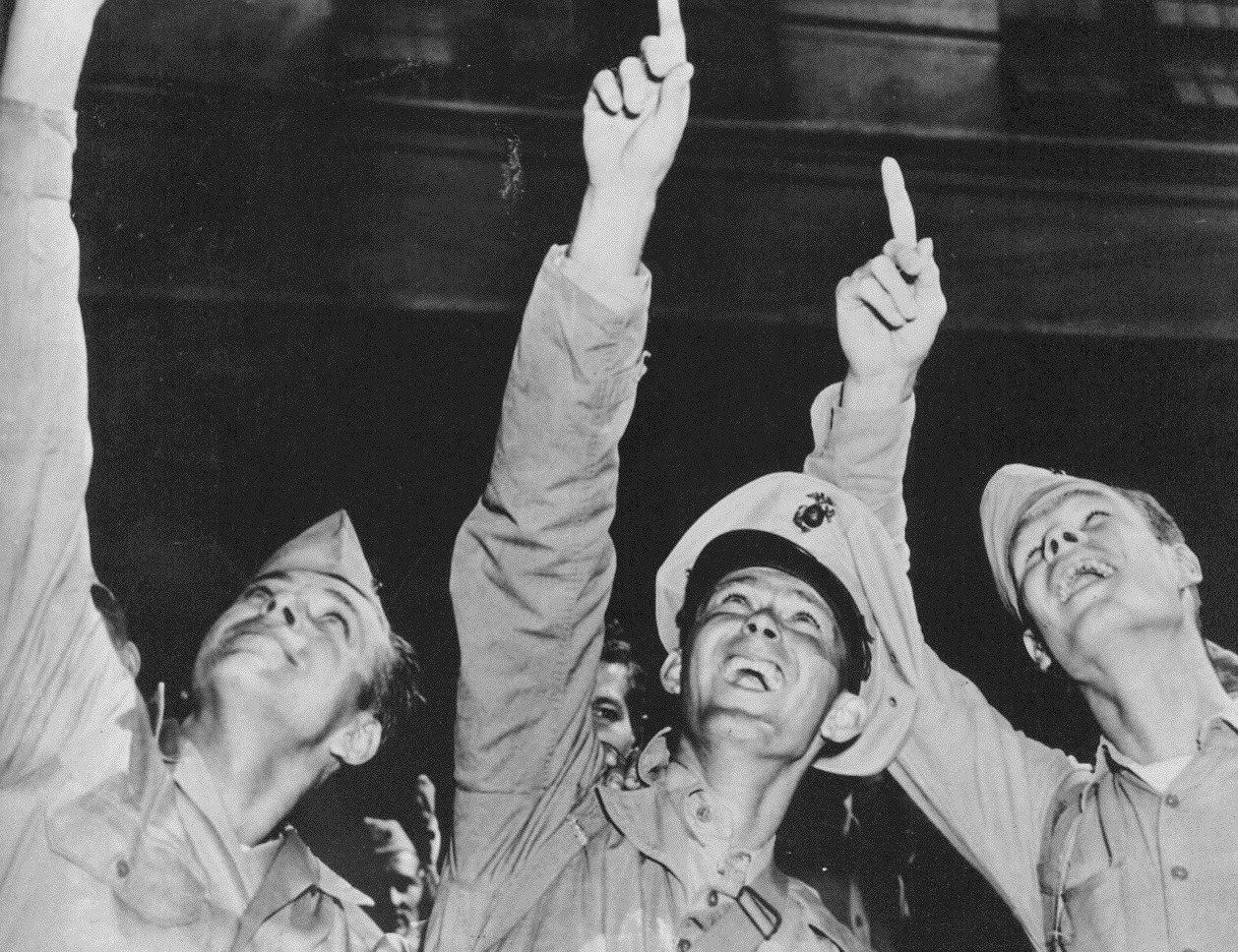 Hey, Look! Lady Marines!, 9/12/1944. San Francisco -- Thrilled with their first glimpse of office buildings, street cars, and lady Marines, these three veterans of famed Second Marine Division, who returned to San Francisco after more than two years of fighting in Central and South Pacific, really enjoy sightseeing. Left to right: PFC Boyd R. Magnuson, Riverside, Calif.; Pvt. Walter C. Tash, Fort Smith, Ark.; and PFC Charles Robinett, Cleveland, Tex. 9/12/44 (ACME);