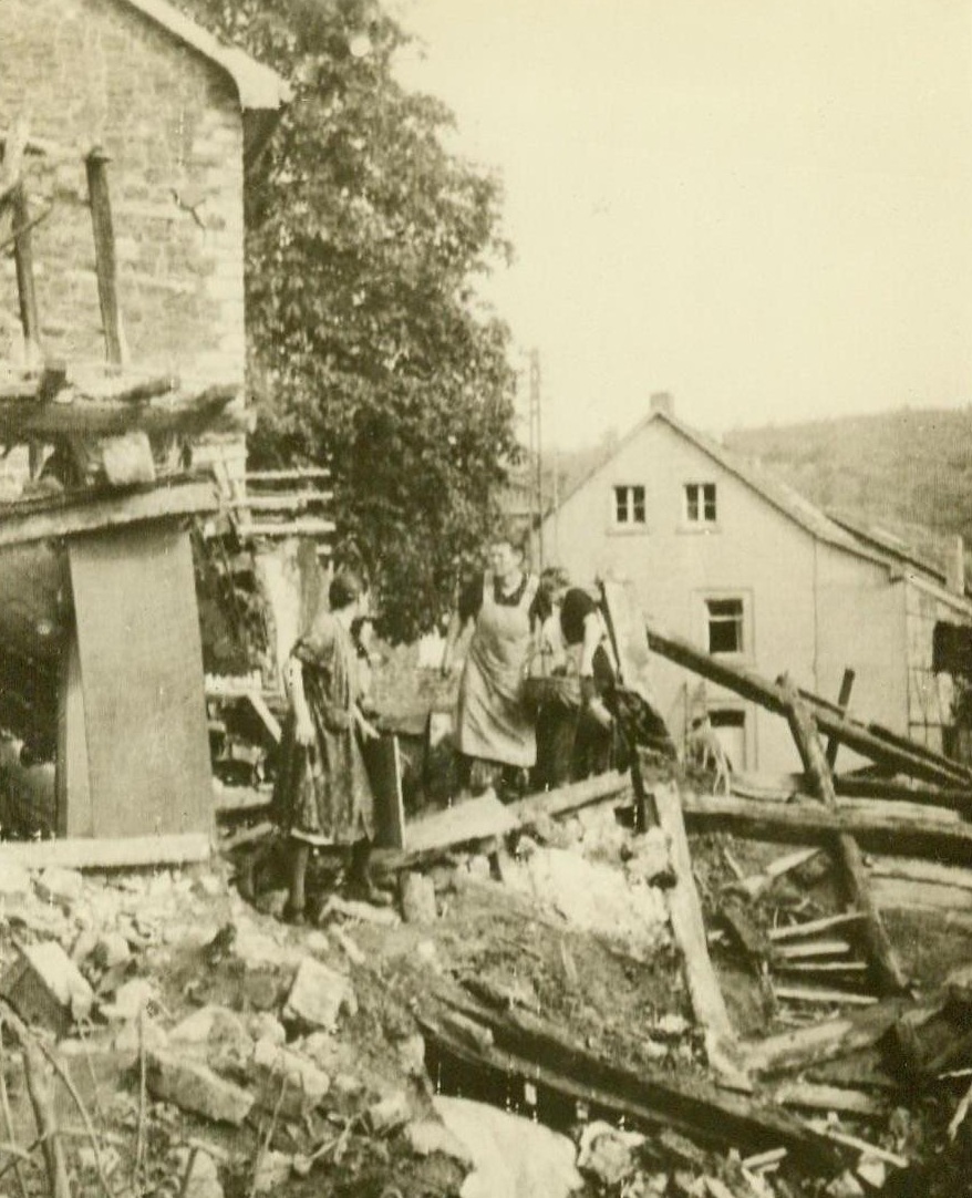 Shoe On The Other Foot, 9/24/1944. Germany – German housewives ruefully inspect the ruins of their shell-wrecked homes as American troops bring the war to the “impregnable” Fatherland. 9/24/44 (ACME);