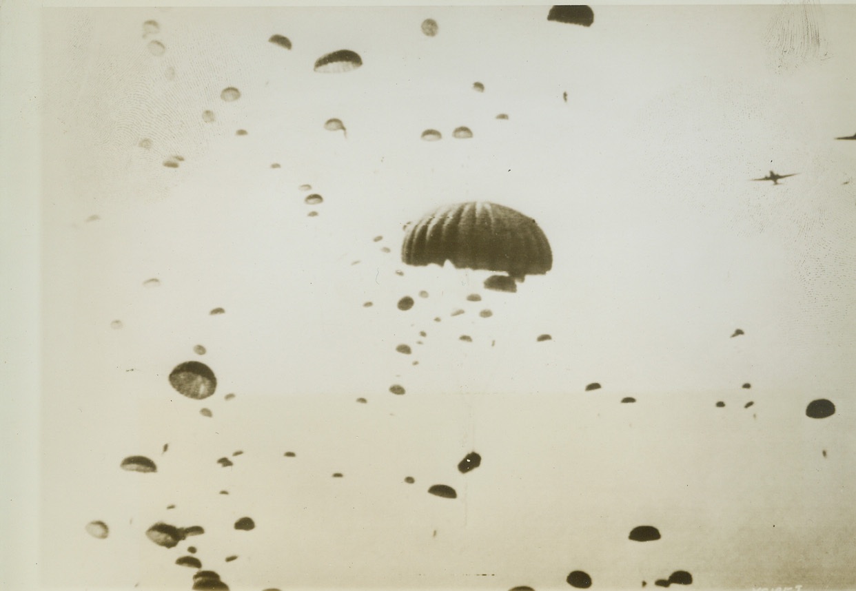 Going Down With Paratroops, 9/27/1944. This photo, taken by a Signal Corps cameraman as he dropped to earth with First Allied Airborne Army troops in the invasion of Holland, shows how paratroopers look in the air. Credit: Army radiotelephoto from ACME;