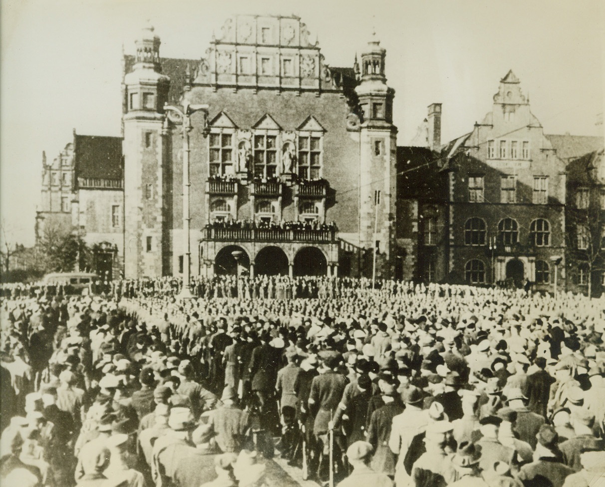 GERMAN PEOPLE’S ARMY IN POSEN, 1/23/1945. German People’s Army units crowd a square in Posen, Poland, to hear an address by Col. Gen. Heinz Guderian, chief of the German general staff, according to caption which accompanied this German photo distributed by a Swedish picture agency and received in New York, Jan. 23 from Stockholm. Occasion was the fifth anniversary of foundation of German province of Wartheland in occupied Poland.Credit: Acme;
