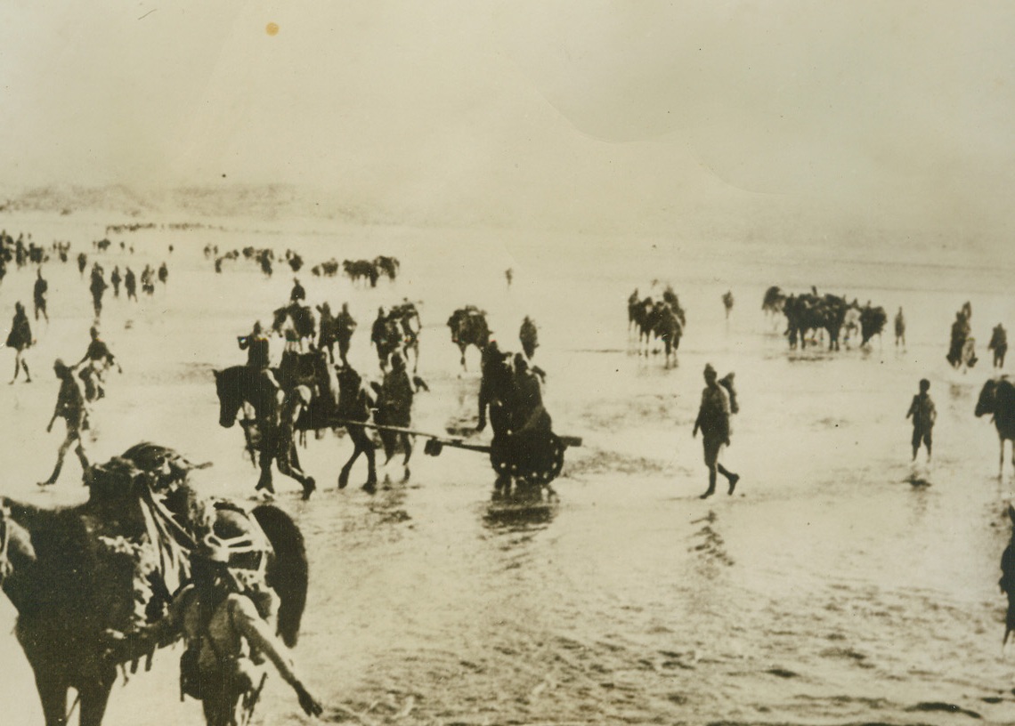 Japs on the Move, 1/24/1945. Somewhere in China – Leading horses laden with equipment, Japanese troops cross a river somewhere in China.  According to the German caption on this photo, which was obtained through a neutral source.Credit Line (ACME);