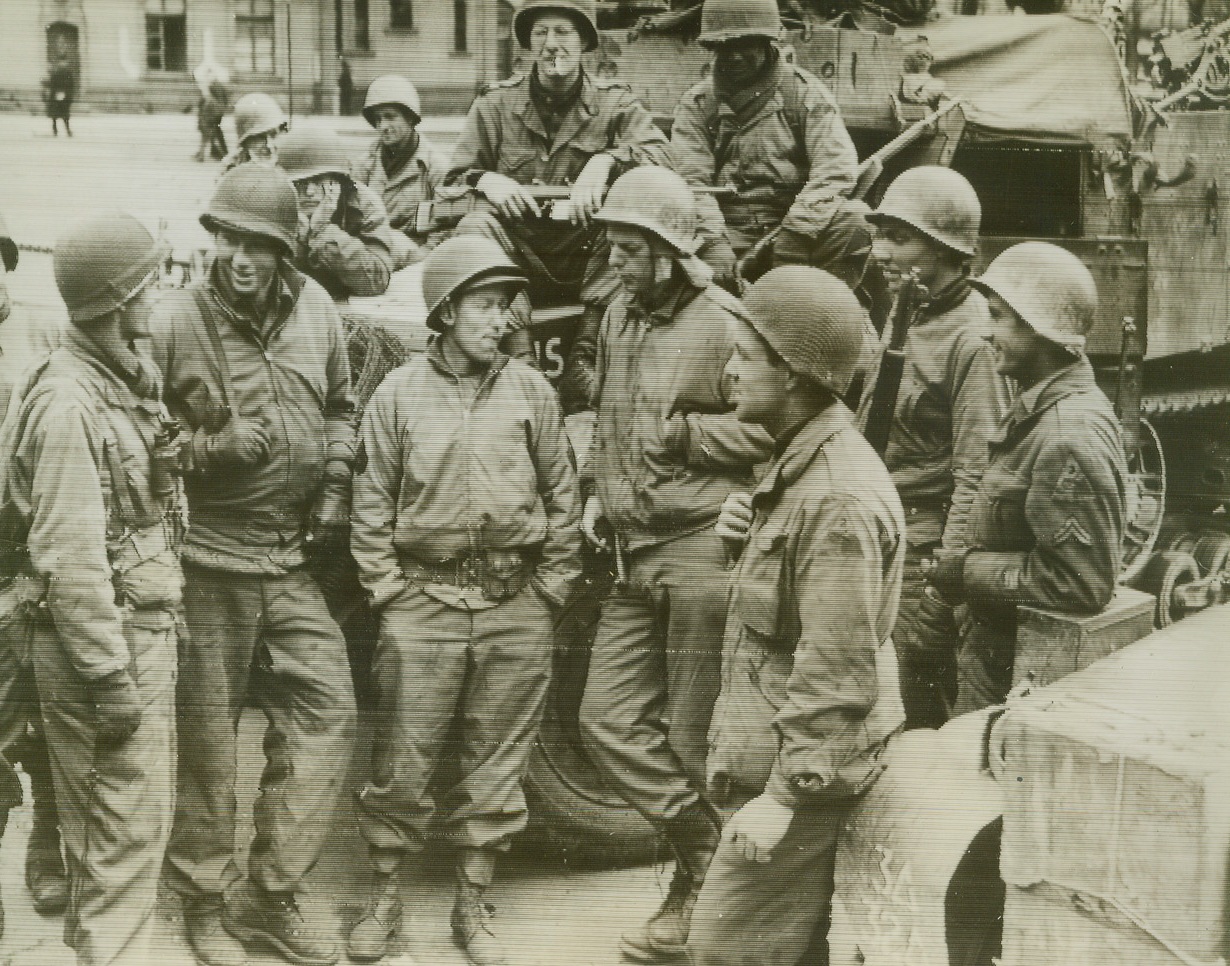 Yanks Join to Cut Ruhr, 4/2/1945. Germany—At Lippstadt, Germany, men of the 2nd Armored Division, U.S. Ninth Army, join forces with the troops of the 3rd Armored Division, U.S. First Army, to complete encirclement of the Ruhr and isolate the industrial heart of Germany. Credit: Radiophoto from ACME.;