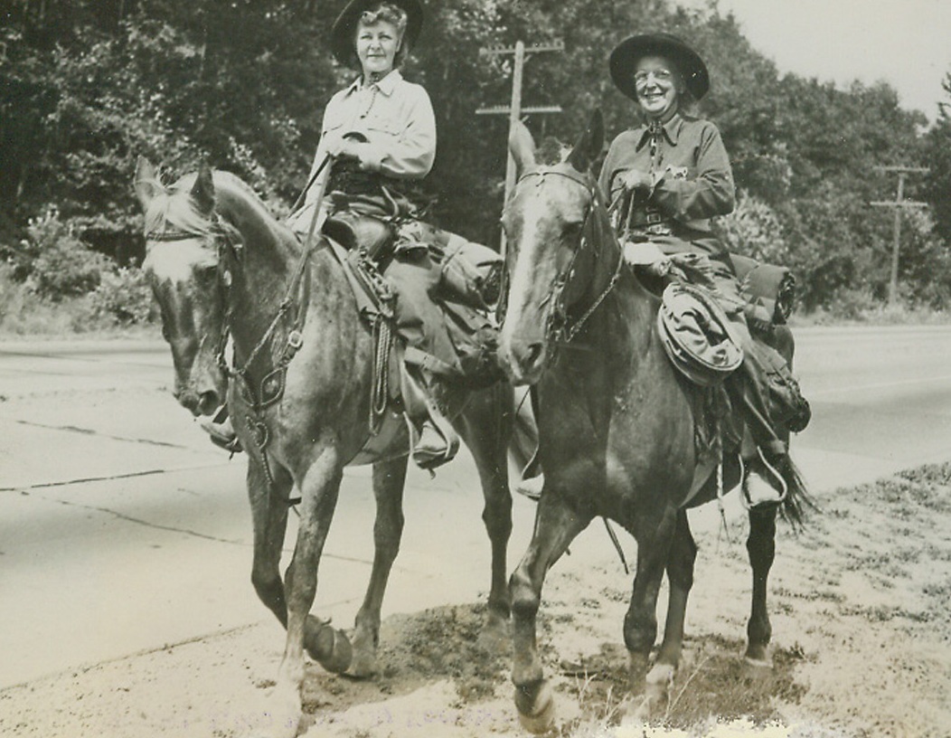 Travel 1,000 Miles by Horseback, 8/17/1945. Seattle, Wash.—Angered by rationing board’s refusal to grant extra gas for trip to northwest, Mrs. Frances N. Davis (left) and Mrs. Nellie McDonald arrive in Seattle, Wash., completing 1,000 mile horseback ride they started June 7 from Santa Cruz, Calif. They intend to return to California on horseback despite lifting of gasoline rationing.;