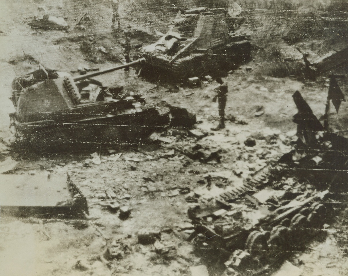 Panzer Graveyard. VELLETRI, ITALY—These panzer units of the German Army were caught and smashed by bombers of the Allied Tactical Air Force in a cut near Velletri, during the current drive on propelled gun, while in right foreground and center background, are wrecked tanks. This photo was flashed from Italy to New York. Credit: OWI RADIOPHOTO FROM ACME.;