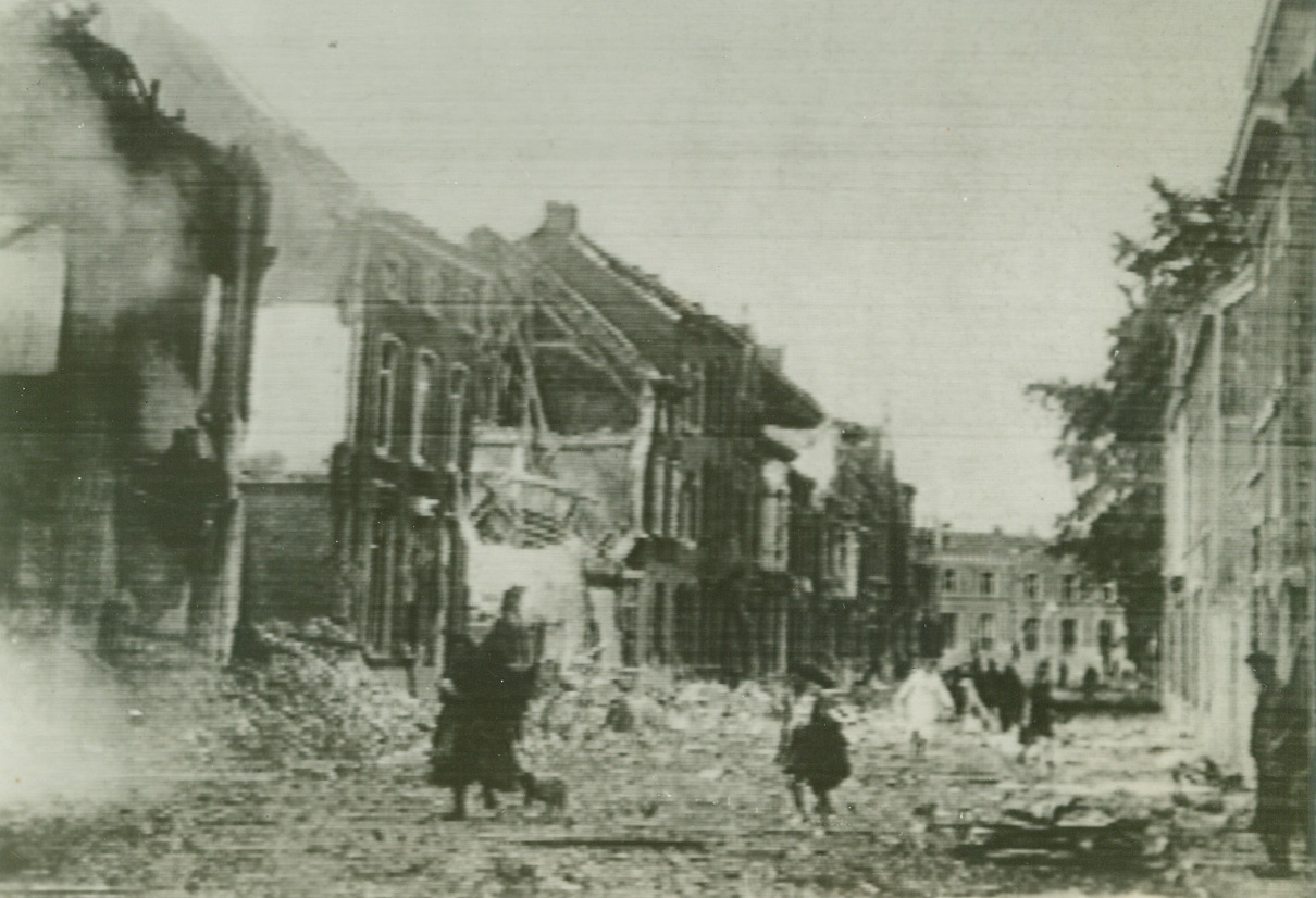 Destruction of Louvain, Belgium, following German air raid.. Cablephoto today from London.;