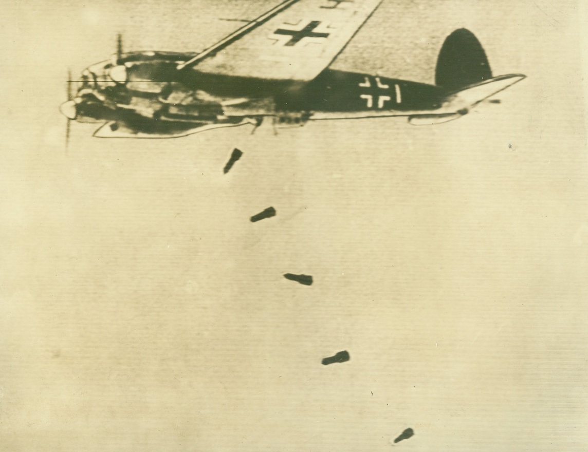 No Title. First pictures taken from the German “Mar Newsreel” showing for first…German bombers actually dropping bombs on England as photographed from…plane in attacking group. Here a German horizontal bomber releases…bombs over England. Action caught by motion picture camer and …;
