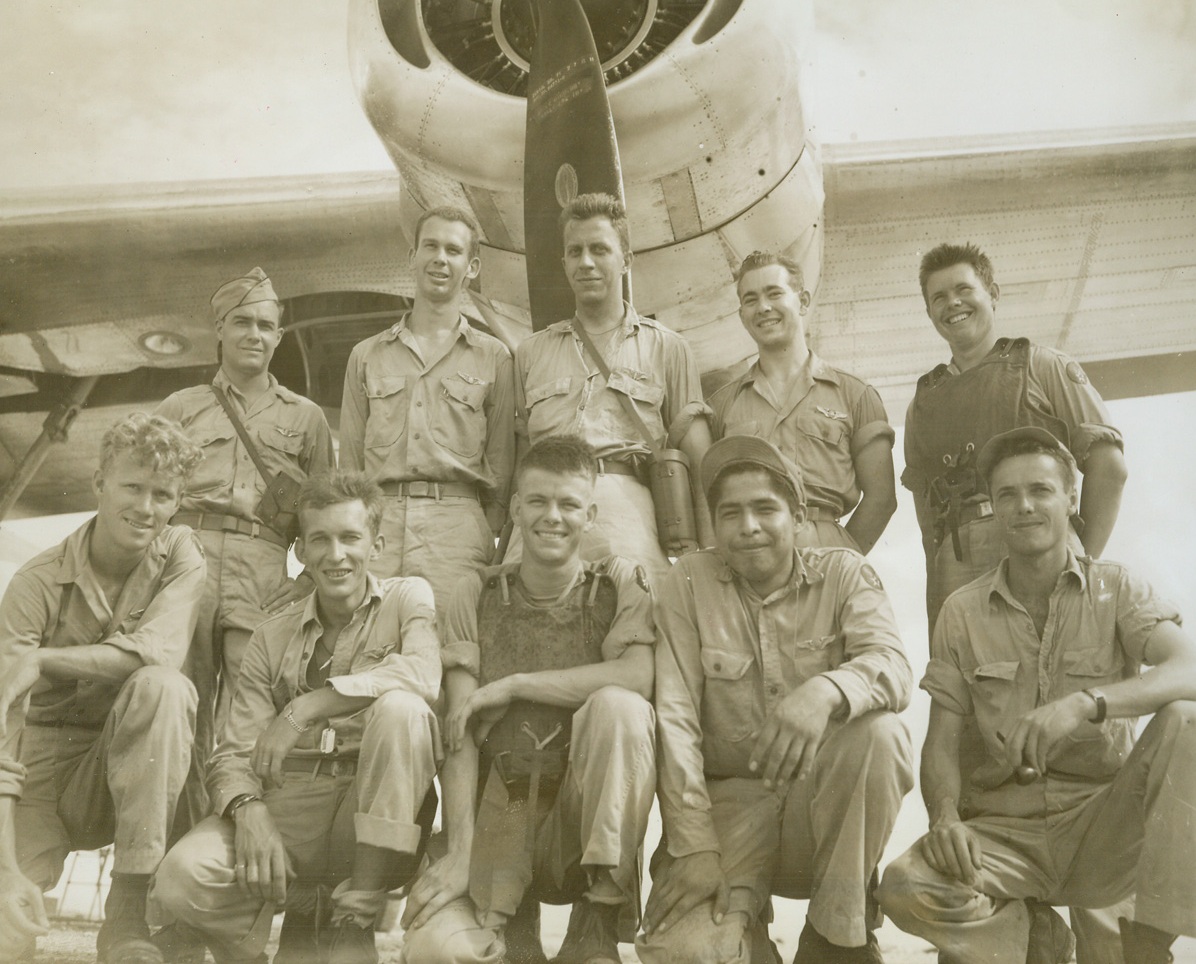 Liberator Makes Record “Three-Engine” Flight. Southwest Pacific – A stricken B-24 Liberator, piloted by Lt. Raymond L. Dufur, Portland, Ore.,  made one of the longest “three-engine” flights on record in the 13th Air Force when it returned safely after one engine was shot out and another was cut off temporarily as gasoline leaked towards red hot exhaust.  The plane began to lose altitude and things looked pretty black for awhile until repairs were made and three engines were functioning again.  Lt. Dufur’s crew is: left to right, front row: Sgt. Thomas Fann, Winter Haven, Fla., gunner; S/Sgt. Marion C. Wiatrowski, Chicago, Ill, radio operator; Cpl. Fred Cox, Vernon, Tex., gunner; Cpl. Wayne P. Moore, Gracemont, Okla., gunner (American Indian from the Delaware tribe) S/Sgt. Eugene Illingworth, Los Angeles, Calif., engineer.  Back row, left to right: Lt. Bill Biddle, Ione, Ore., co-pilot; Lt. Raymond L. Dufur, Portland, Ore., pilot; Lt. Leo R. Nowak, 6710 Campbell, Chicago, Ill., Bombardier; Lt. Lester Arnold, Dayton, Ohio, navigator; and Cpl. Burlick Andreport, Jr. Eunice, La., gunner.Credit (ACME photo by Thomas Shafer, War Pool;