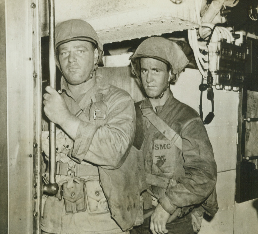 ROUGH AND READY RAIDERS. This photo, released in Washington today, shows two tough and determined U.S. Marine raiders as they were about to go topside on the U.S. submarine which brought them to Makin Island for the successful raid in which they took part, last August 17-18.  Credit: U.S. NAVY PHOTO FROM ACME.;