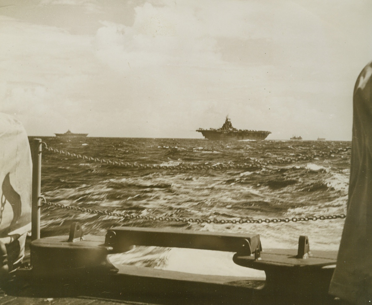Newest Flat-Tops Head for Action. One of the first pictures to be released of the U.S. Navy’s most modern, hard-hitting carriers on a combat mission, shows the flat-tops of the 25,000-ton Essex class strung out along the horizon heading for enemy-held Wake Island. Carrier-based Dauntless dive bombers, Grumman Avenger torpedo planes, and Grumman Hellcats have shot scores of enemy planes from the sky, pounded shipping and shore installations, and afford cover for our bombers. Credit: Official U.S. Navy photo from ACME;