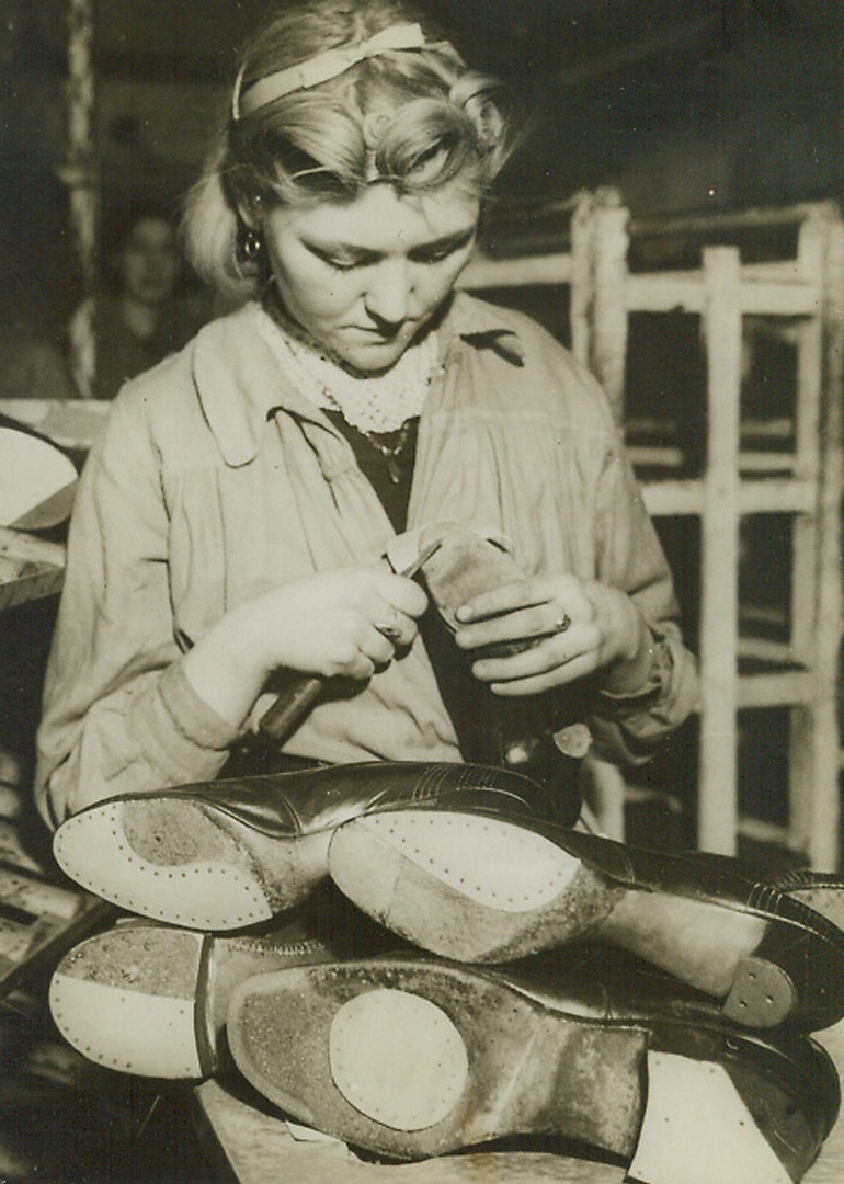 No Title. Repairing shoes in England.;