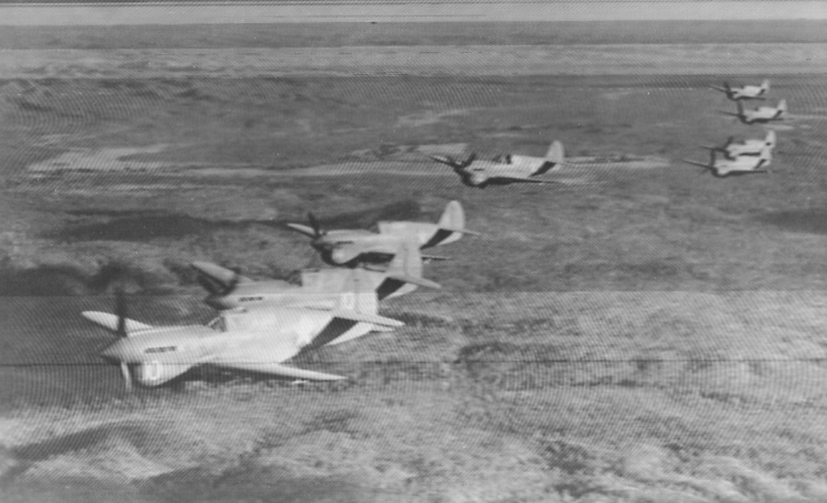 Patrol Land Down Under. Squadron of American P-40’s manned by American fighting pilots on patrol somewhere over Australia.Photo approved by U.S. Army Bureau of Public Relations, Washington, D.C.;