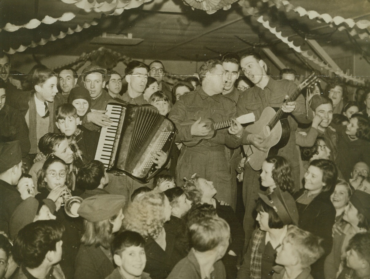 Canadians Entertain Kids at Christmas Party.