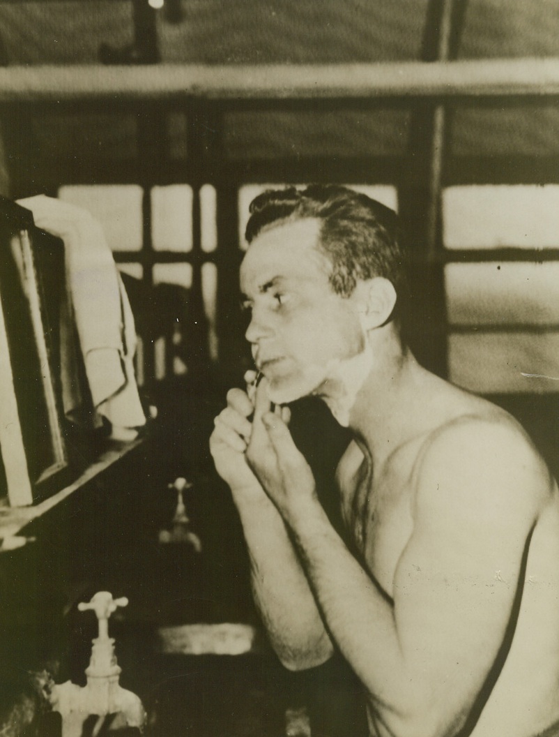 Credited With 27 Kills. England - America’s Air Ace in the European Theatre of Operations takes time out from his daily task of downing German planes to freshen up with a shave. Once over lightly may be his mode of shaving but Nazi pilots haven’t been taking his air maneuvers so lightly. Capt. Robert S. Johnson, Lawton, Okla., has become America’s King of Aces in this war-toughened air theatre by shooting down 27 enemy planes. Credit: US Army Radiotelephoto from ACME;