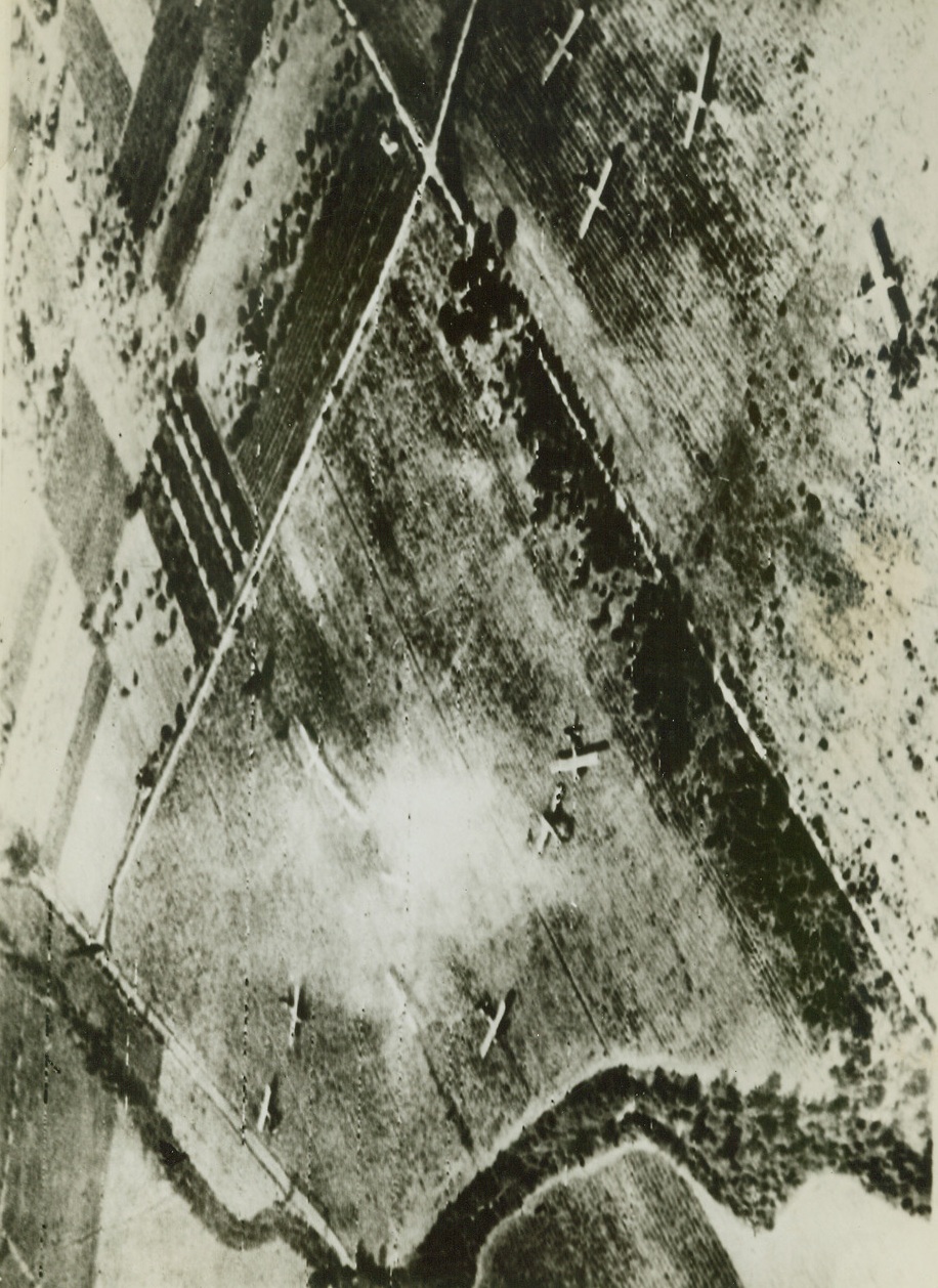 AIRBORNE TROOPS IN SOUTH FRANCE. In this photo, one of the first received of the allied invasion of Southern France, gliders which carried airborne allied troops to the new beachhead are parked in fields after accomplishing their mission…..the remainder of this caption is torn – illegible.;