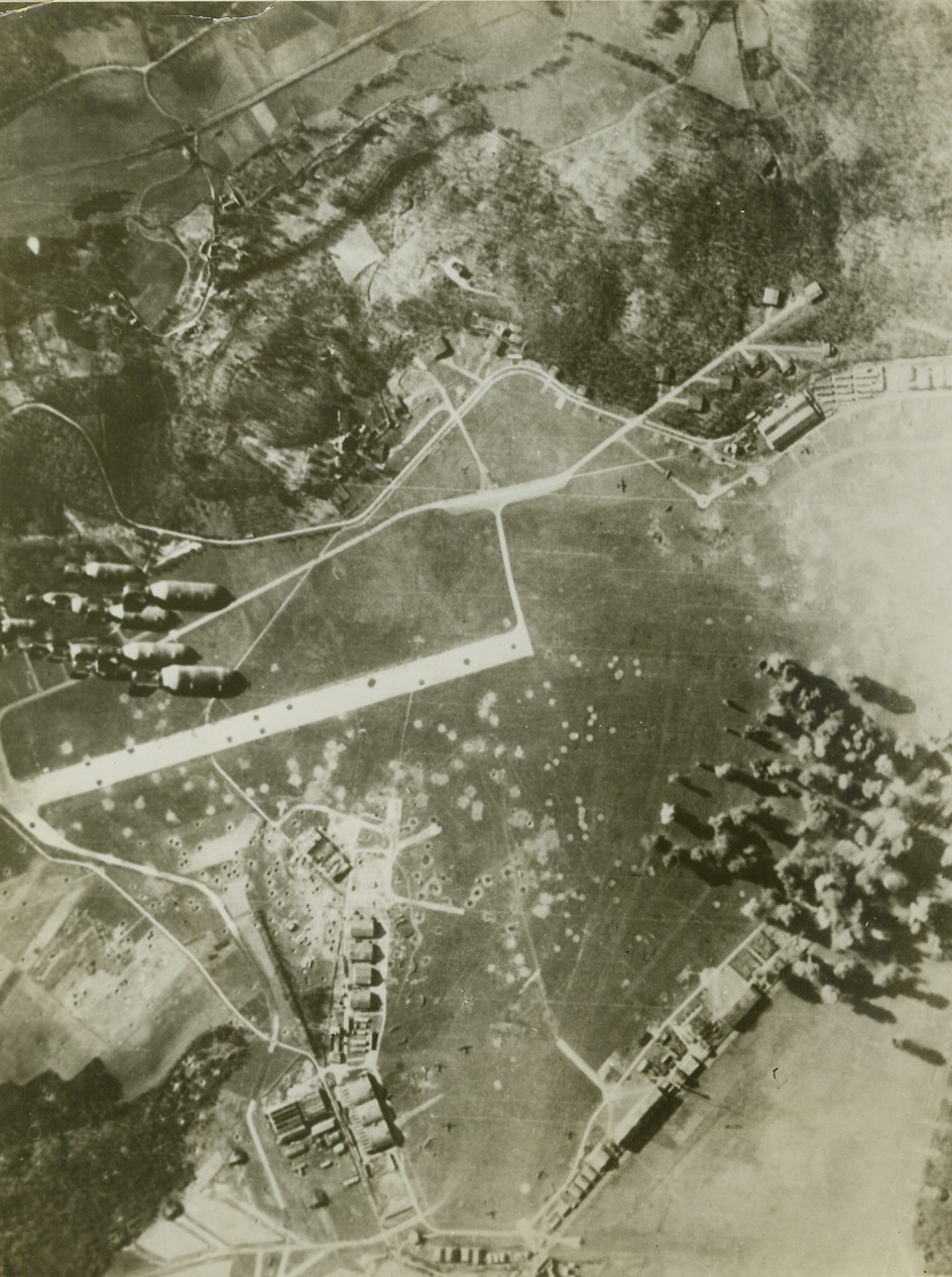 POUNDING NAZI AIRFIELDS.FRANCE – Eighth Air Force heavy bombers attacked six Nazi airfields in France on February 5th including the important aircraft repair and overhaul base at Villacoublay near Paris. A formation of bombs, whiz down… Credit line (ACME);