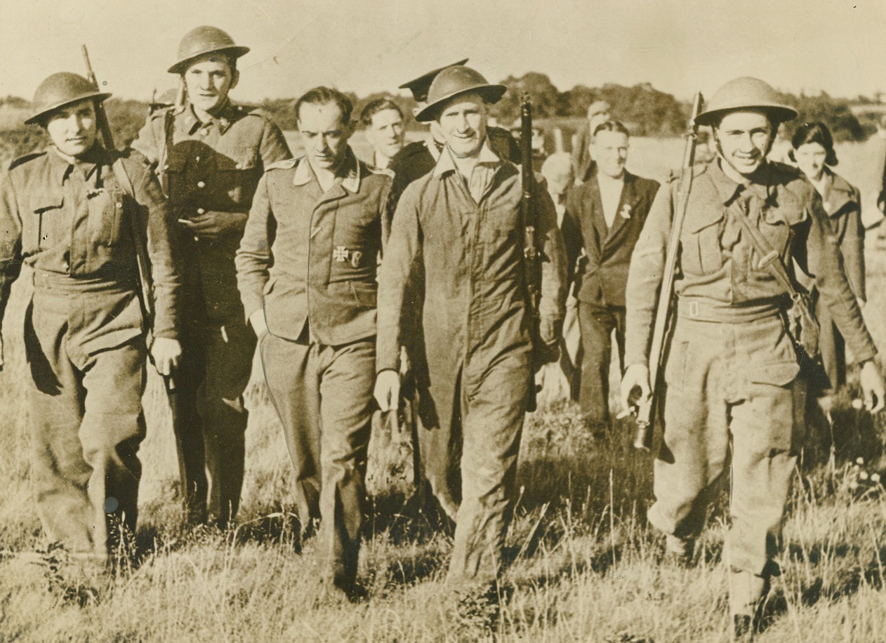 No Title. Dover, England—British Home Guardsmen escort downed Nazi airmen.;