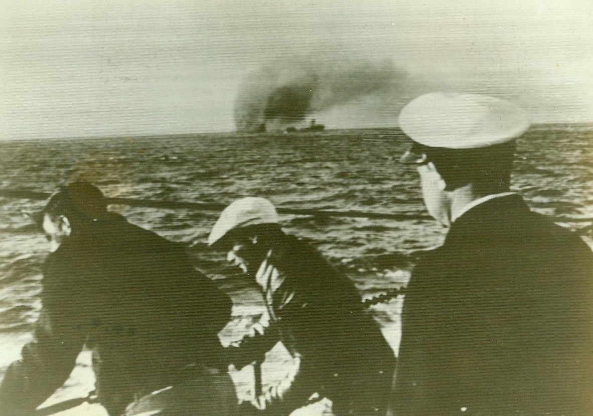 No Title. SF76 – In a picture taken from a rescue ship, crewmen are shown rigging ladders over the side of their ship as they approach a torpedoed and burning tanker, the latest victim of Jap sub warfare off the Pacific Coast.;