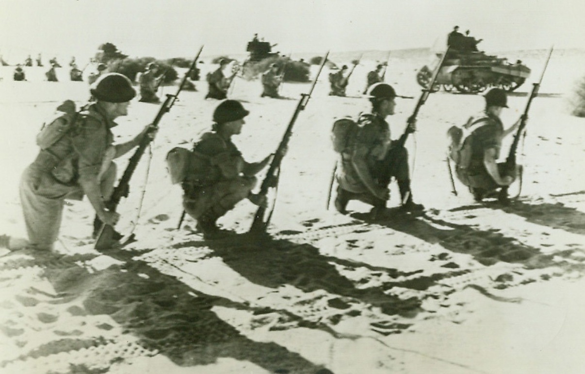 No Title. Picture of Australian troops and tanks, in African desert warfare, arrived in New YOrk today simultaneously with announcement that Australian troops.... were stroming the Italian port Bardia.;