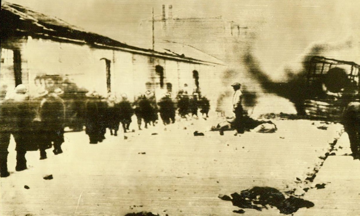 No Title. Passing wreckage in street of Dunkirk on way to embarkation. Passed by censor. Credit: ACME;