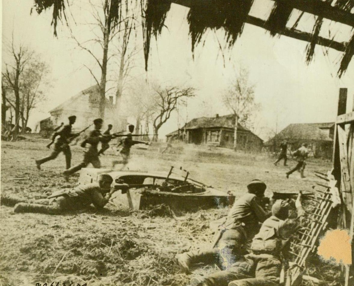 Soviet troops rout German garrison. SOMEWHERE IN RUSSIA – Red Army men rush in to finish off Nazi stragglers after a fierce battle for the possession of a Soviet village during which the German forces were driven out.;