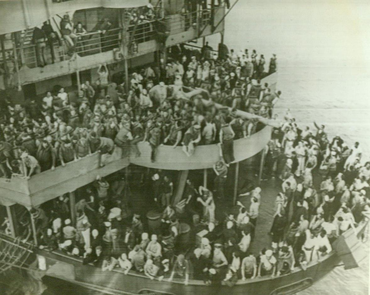 No Title. ...stern of the U.S.S. Wakefield as life-belted passengers and crewmen await transfer to rescue vessel after abandon sihp order had been given.;