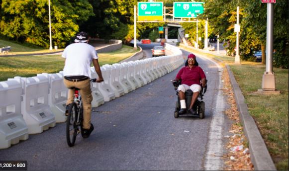A suitably protected two-way cycletrack or sidepath can provide an alternative route for mobility devices.
