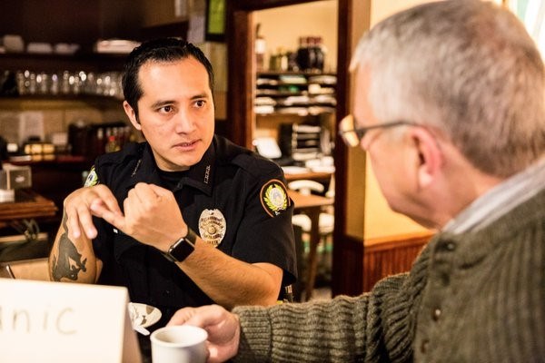 Officer and citizen discussing Hispanic relations at LRPD