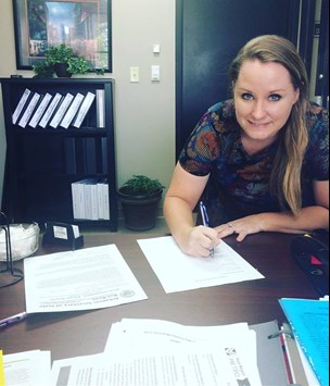 Photo of Friendly Driver Instructor Stacy Tierney at a desk