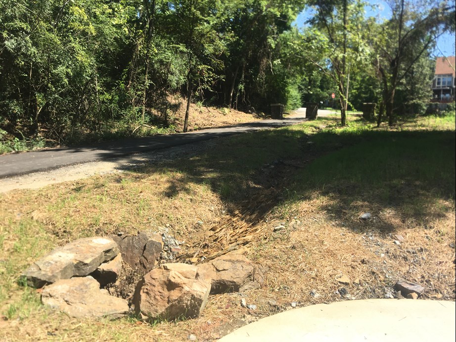 The new trail intersects with the existing Allsopp Trail where it exits onto Cedar Hill Dr.