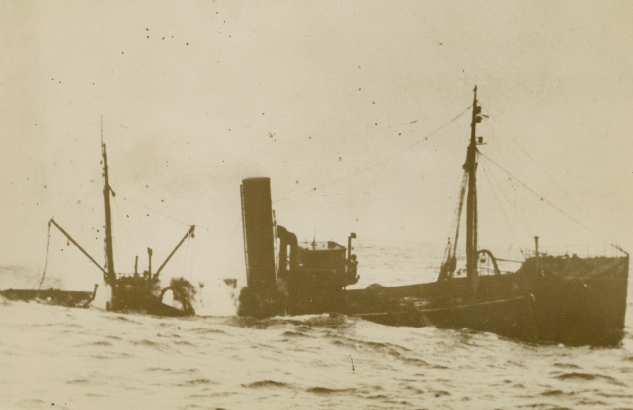 British Trawler Goes Down in the North Sea, 1/7/1940 On the North Sea—This is one of the series of exclusive pictures made of the sinking, in the North Sea, of a British trawler by a German U-Boat. Here is the trawler, her hull ripped apart, starting to settle at the stern. Credit: ACME. Caption from German sources, passed by censor.;